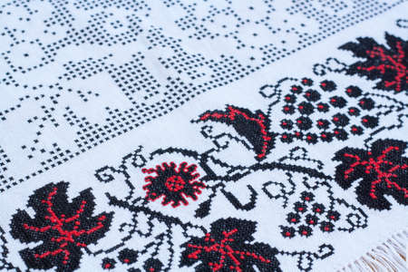 Towel for the icon with the red-black Ukrainian embroidery, selective focusの写真素材
