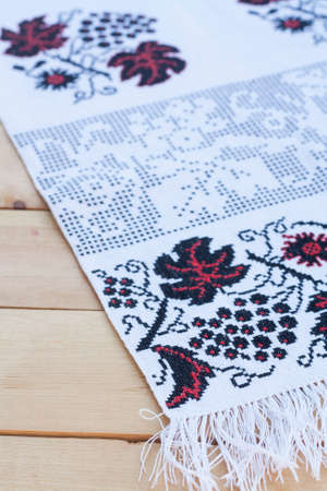 Towel for the icon with the red-black Ukrainian embroidery, selective focusの写真素材