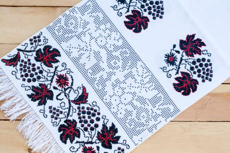 Towel for the icon with the red-black Ukrainian embroidery, selective focusの写真素材