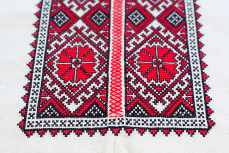 Shirt with national Ukrainian embroidered red and black colors, selective focusの写真素材