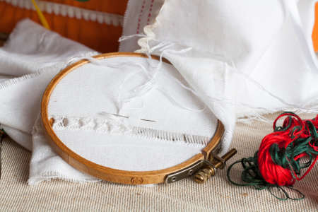 Openwork embroidery, incomplete work in progress and tools for embroideryの写真素材