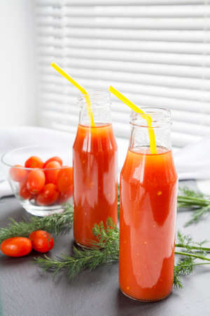 Natural and fresh tomato juice in small bottlesの写真素材