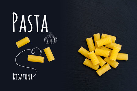 Uncooked Italian pasta Rigatoni on black slate stone background with white lettering, top view