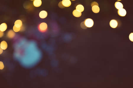 Abstract Bokeh blurred color light Christmas, New Year and other holiday backgroundの写真素材