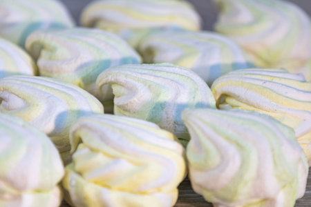 Background or texture of colorful marshmallows on light table background. Shallow depth of the...