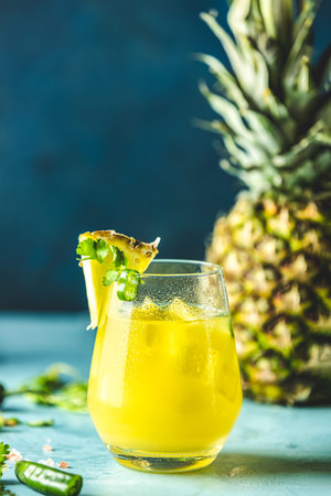 Spicy pineapple jalapeno mezcalita or margarita for Cinco de Mayo is a refreshing cocktail made with...