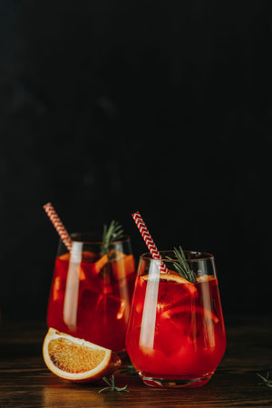 Two glasses Cocktail , a touch of bitter from  gorgeous fizz from the champagne topper. Dark...