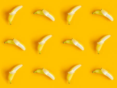 Tropical abstract background. Juicy ripe banana pattern on yellow background top.  Seamless pattern with bananas.の写真素材