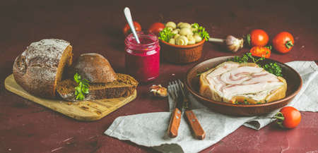 Tasty baking pork lard bacon fatback with black pepper and other herbs and spices in ceramic dish. Traditional Christmas Ukrainian, Hungarian, Polish or other Eastern Europe national dishの写真素材
