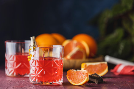 Two glasses of chocolate red orange negroni, an italian cocktail, an aperitif, first mixed in...