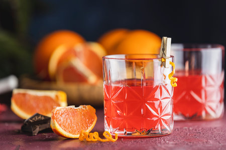Two glasses of chocolate red orange negroni, an italian cocktail, an aperitif, first mixed in...
