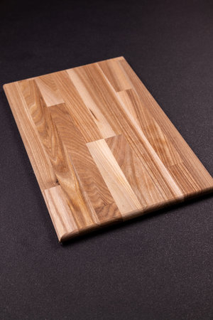 Wooden cutting board featuring a unique natural wood grain pattern, showcasing craftsmanship and...