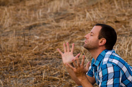 Man praying raising hands in praise.の写真素材