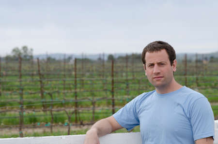 Close up of man in a vineyard looking at the camera.の写真素材