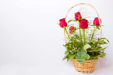 A beautiful bouquet of red roses in a basket,photographyの写真素材
