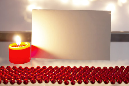 Beautiful ornaments, candles and greeting card as a New Year decoration, photography