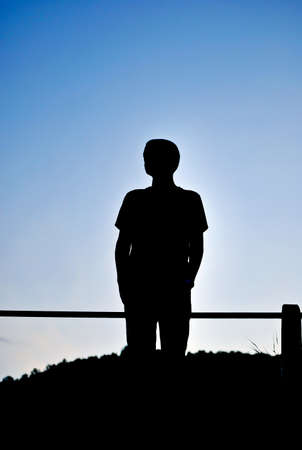 silhouette of a man on a mountainの写真素材