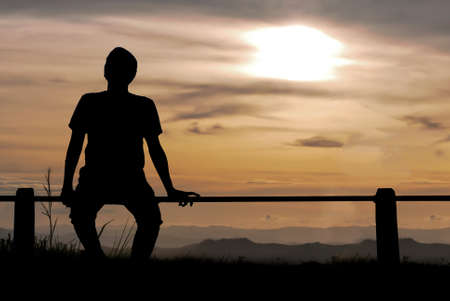 silhouette man on the hillの写真素材