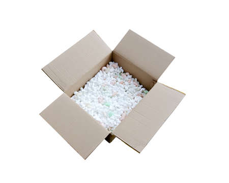 A cardboard box with packing foam pellets top viewの写真素材