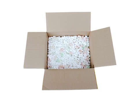 A cardboard box with packing foam pellets top viewの写真素材