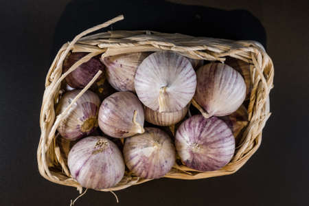 garlic cloves isolated in basket on white 2018の写真素材