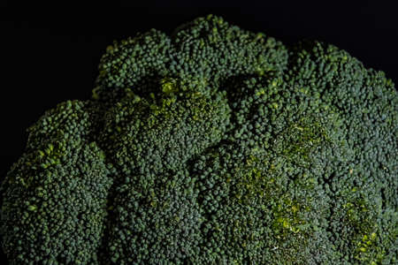 Broccoli cabbage on a black background close-upの写真素材