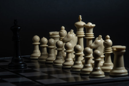 Plastic chess closeup on a black background. A game