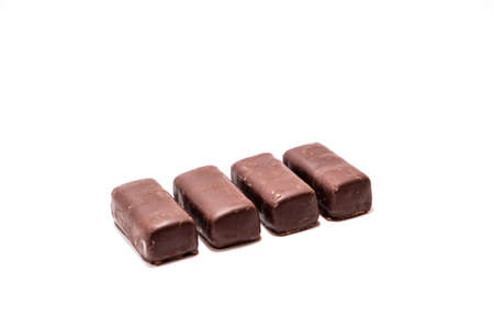 Chocolate candies on white background close upの写真素材