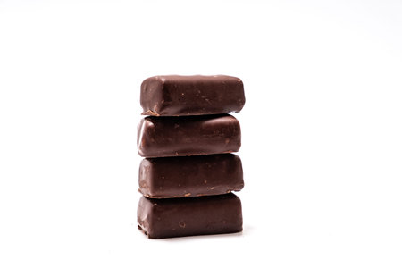 Chocolate candies on white background close up