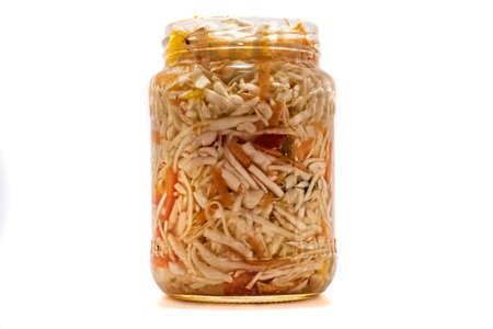 Preserved cabbage and red paprika salad in glass jar on a white background 2018の写真素材