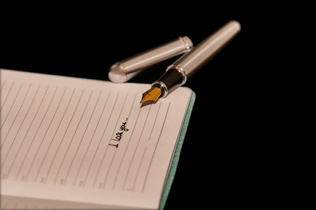 Fountain pen next to a notepad with the inscription 2019