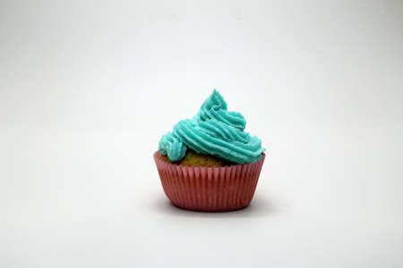 Chocolate muffin with blue cream in tartlets.の写真素材