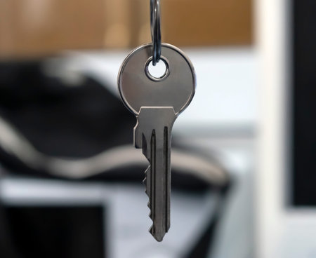 Office key hanging on a ring with a blurred background