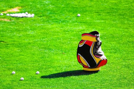 picture of a golf bag on the grassの写真素材