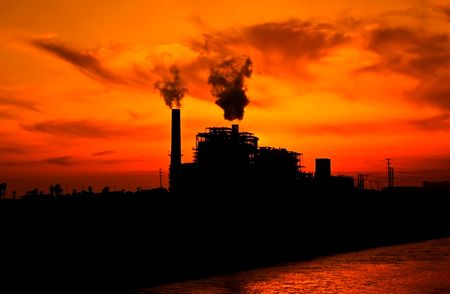 Picture of a factory on the sunset backgroundの写真素材