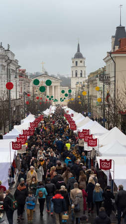 Vilnius/Lithuania - 07 03 2020: People during St. Casimir feast. Many people in crowded street of a fair despite CORONA virus breathing to their backsのeditorial素材