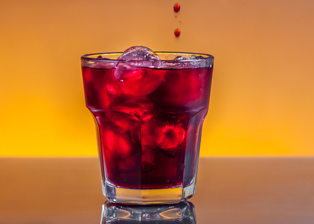cranberry juice with ice cubesの写真素材