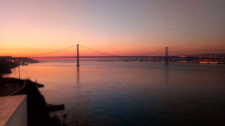 Sunset over the city. Sunset at the bridge.の写真素材