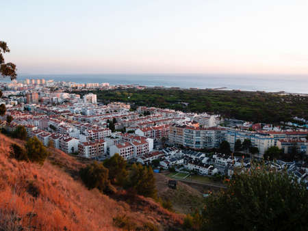 Sunset over the city. Coast line city.の写真素材
