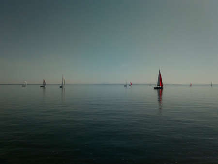 Sailing boats. Sailing boats in serene waters.の写真素材