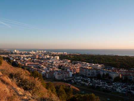 View from above. Overview of the city. Sunset over Costa da Caparica.の写真素材