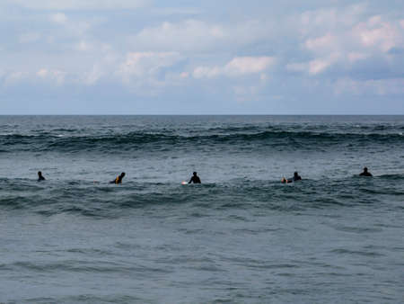 Group of surfers waiting for waves on 10 of October in Costa da Caparica, Portugal.のeditorial素材