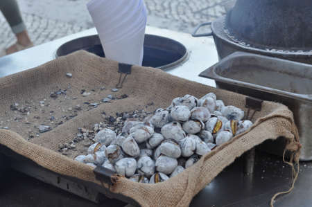 Hot Roasted chestnuts in the streets of Lisbon, Portugal in mids October 2018.の写真素材