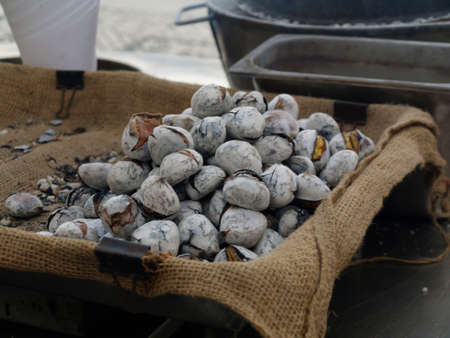 Hot Roasted chestnuts in the streets of Lisbon, Portugal in mids October 2018.の写真素材