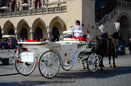 Cab in the main square - old town in Krakow, Poland