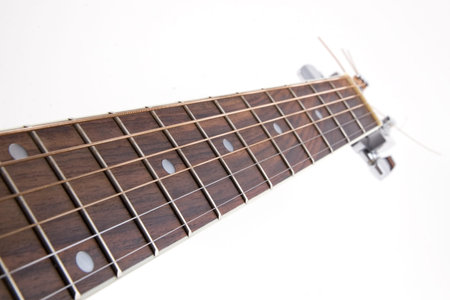 Acoustic guitar's neck on white