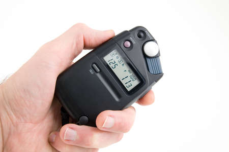 Light meter in the hand on white backgroundの写真素材
