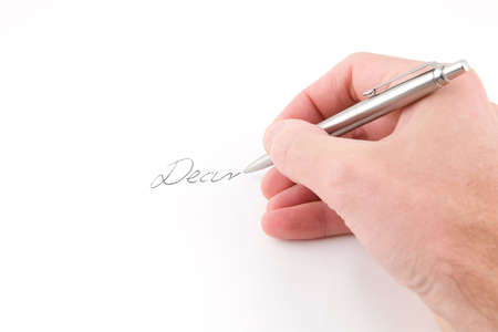 Hand holding penの写真素材