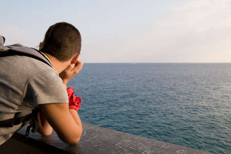 Woman looking at Ligurian's Sea horizonの写真素材