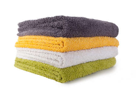 Four colorful towels isolated on white backgroundの写真素材